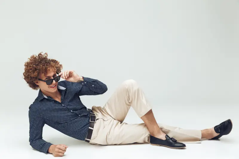 retro-man-dressed-shirt-lies-floor-posing